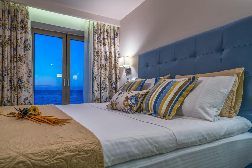 Posteľ alebo postele v izbe v ubytovaní Perla Beach Villa Perla Beach Villa