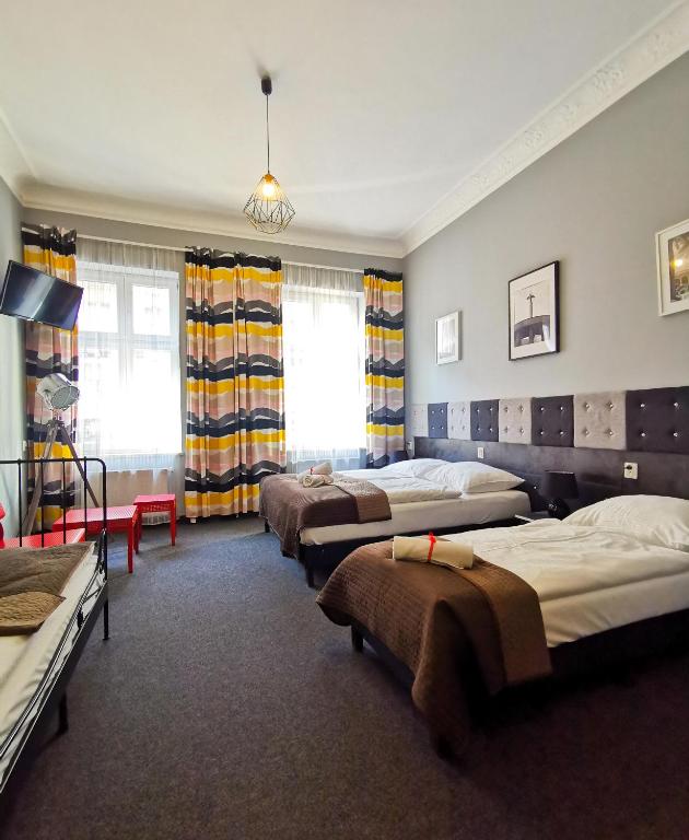 Postel nebo postele na pokoji v ubytování Expolis Residence - City Center MTP TARGI - 24h #betterthanyourEX