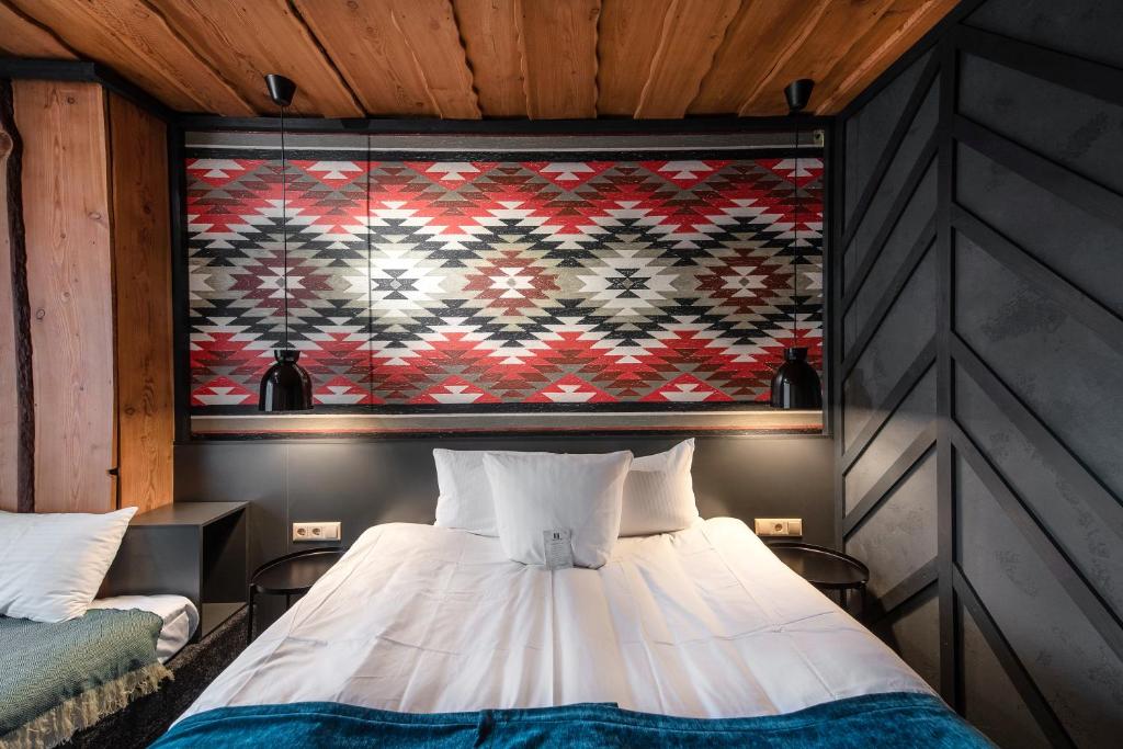 Postel nebo postele na pokoji v ubytování Stara Pravda Hotel - Vykrutasy