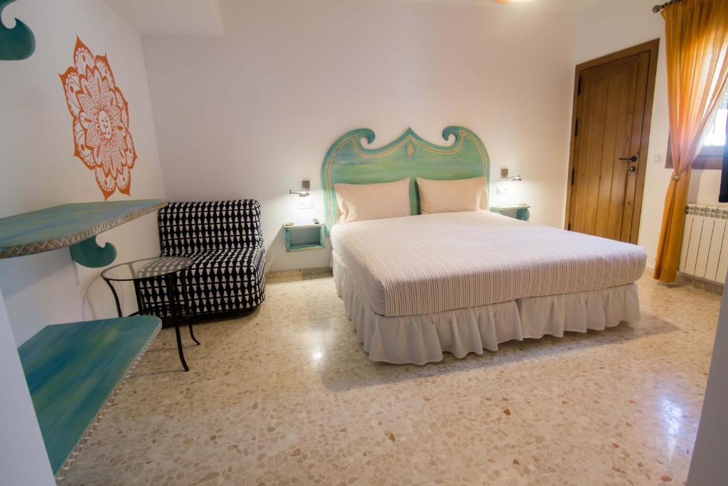 Postel nebo postele na pokoji v ubytování Hostal Casa Arco Iris (Playa)