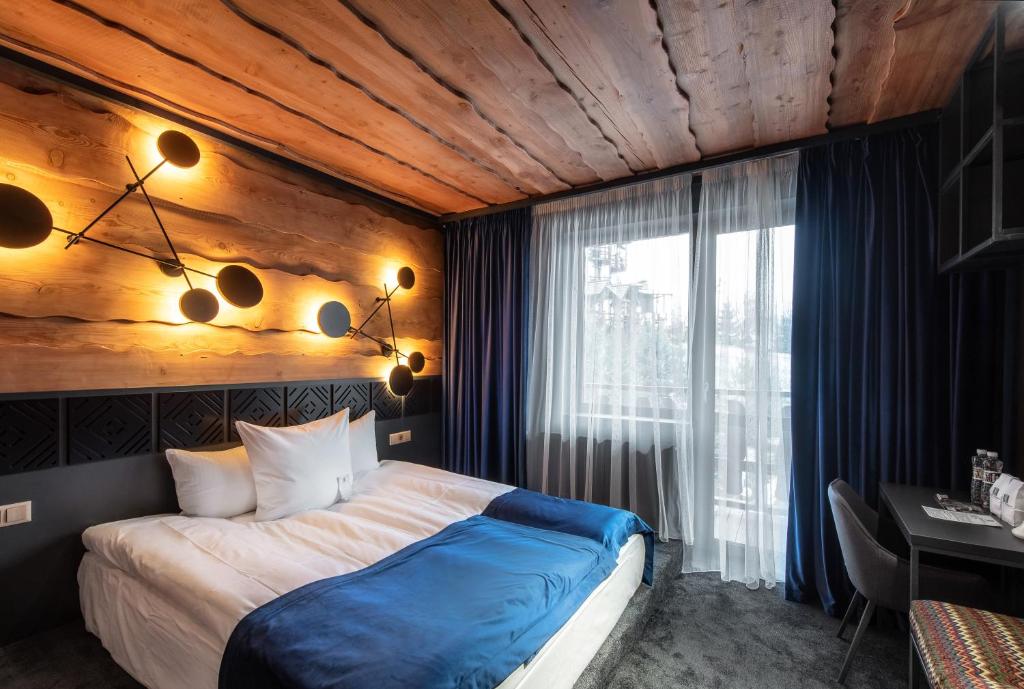 Postel nebo postele na pokoji v ubytování Stara Pravda Hotel - Vykrutasy