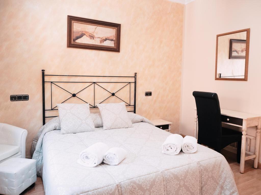 Postel nebo postele na pokoji v ubytování Hotel Los Toreros