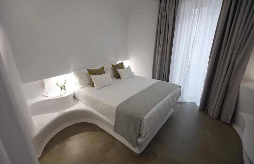 Postel nebo postele na pokoji v ubytování Hotel Suite Generis