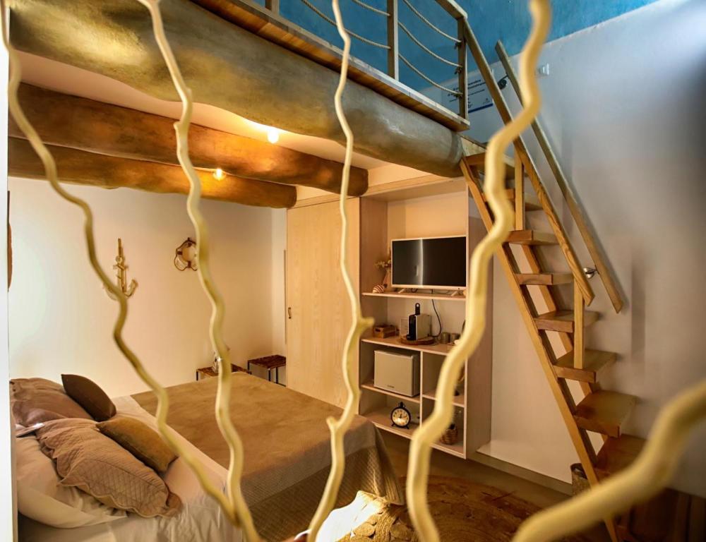 a room with a bed with a tree branch design at b&b le onde praiola in Terrasini