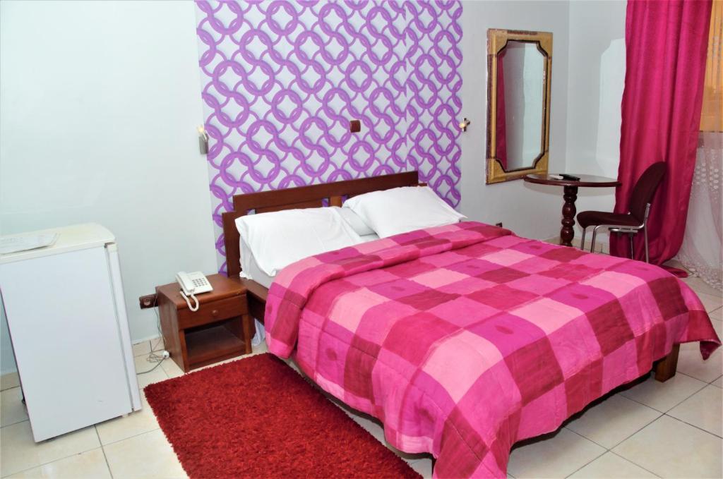 Postel nebo postele na pokoji v ubytování Hotel - Y