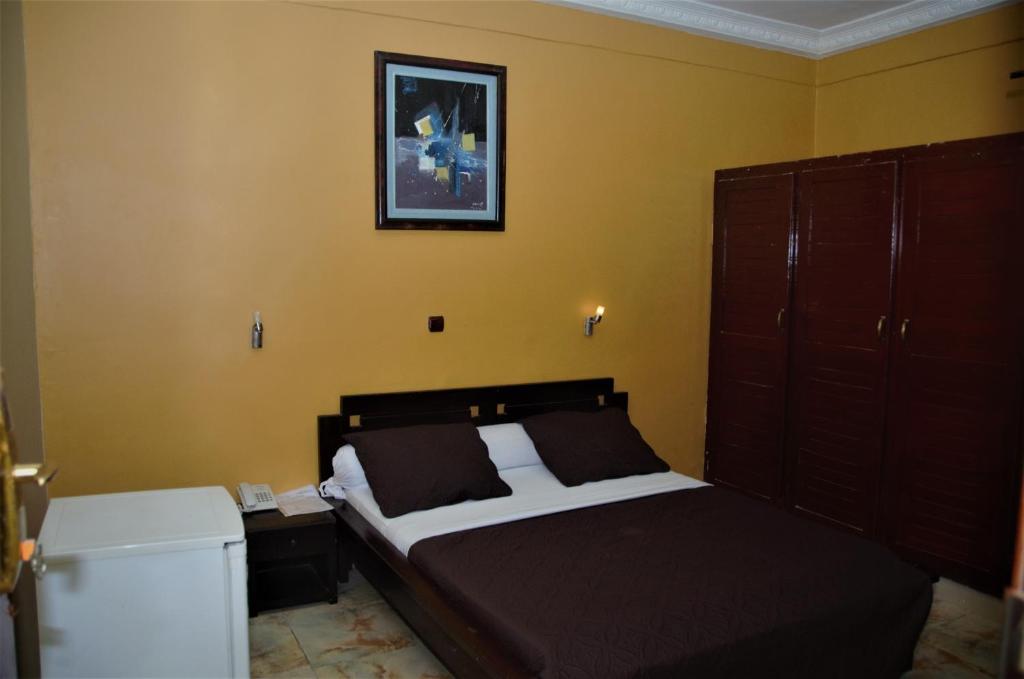 Postel nebo postele na pokoji v ubytování Hotel - Y