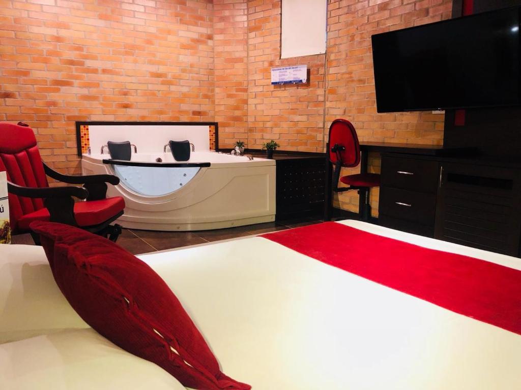 TV a/nebo společenská místnost v ubytování Hotel Toscana Oriente