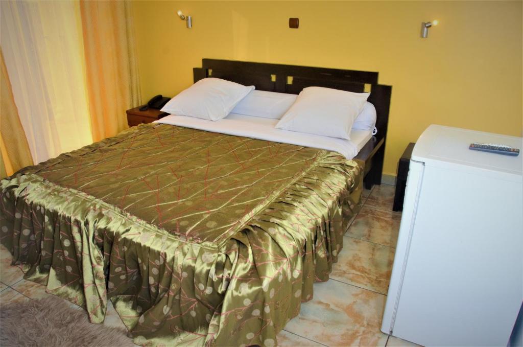 Postel nebo postele na pokoji v ubytování Hotel - Y