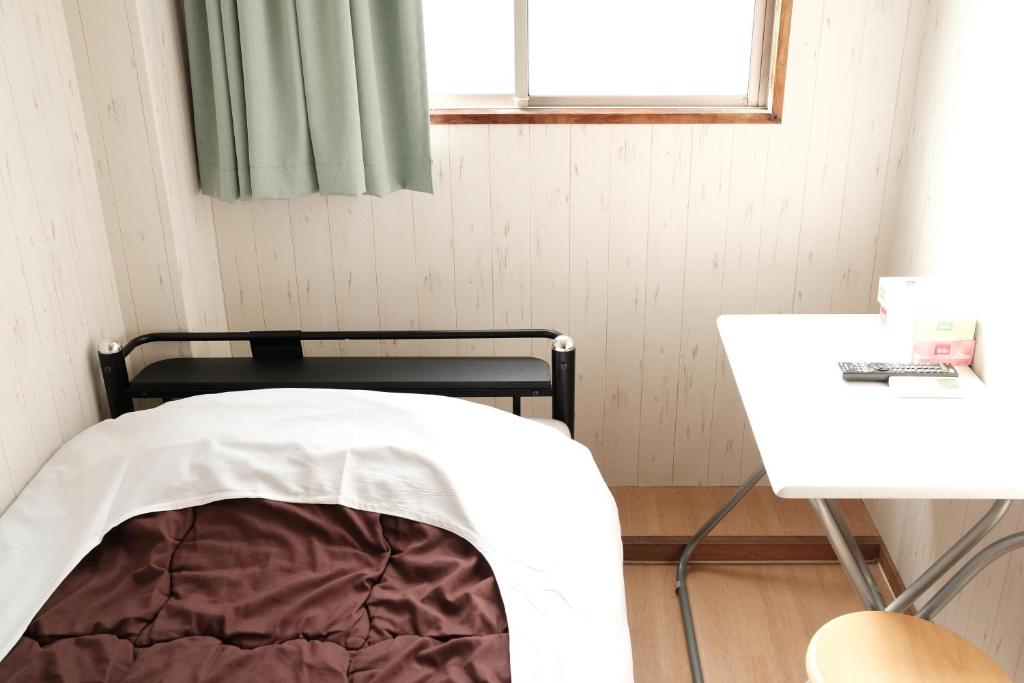 Postel nebo postele na pokoji v ubytování Hotel Mikado