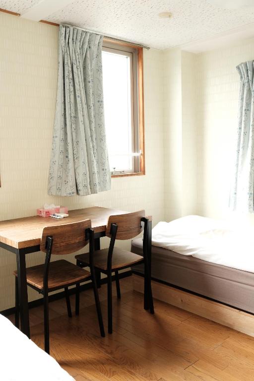 Postel nebo postele na pokoji v ubytování Hotel Mikado