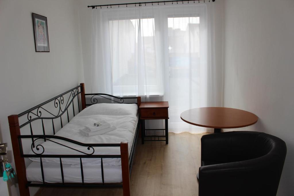 Postel nebo postele na pokoji v ubytování Hotel Černý kůň
