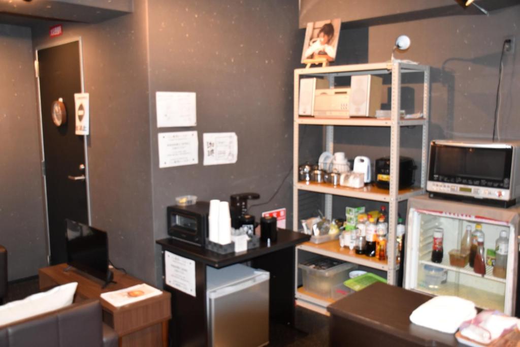 Kuchyň nebo kuchyňský kout v ubytování Hotel Mikado