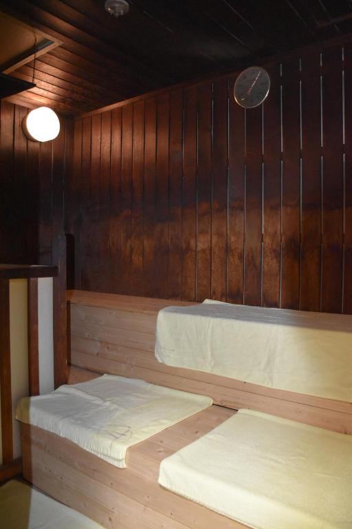 Postel nebo postele na pokoji v ubytování Hotel Mikado