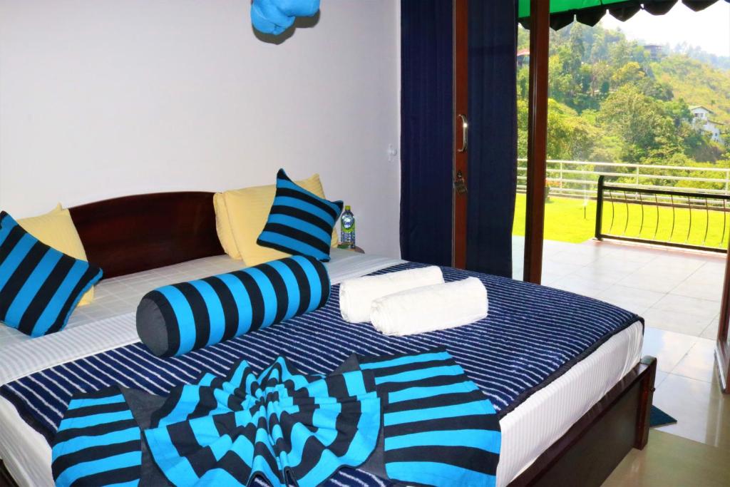 Postel nebo postele na pokoji v ubytování Hotel Ella`s Edge