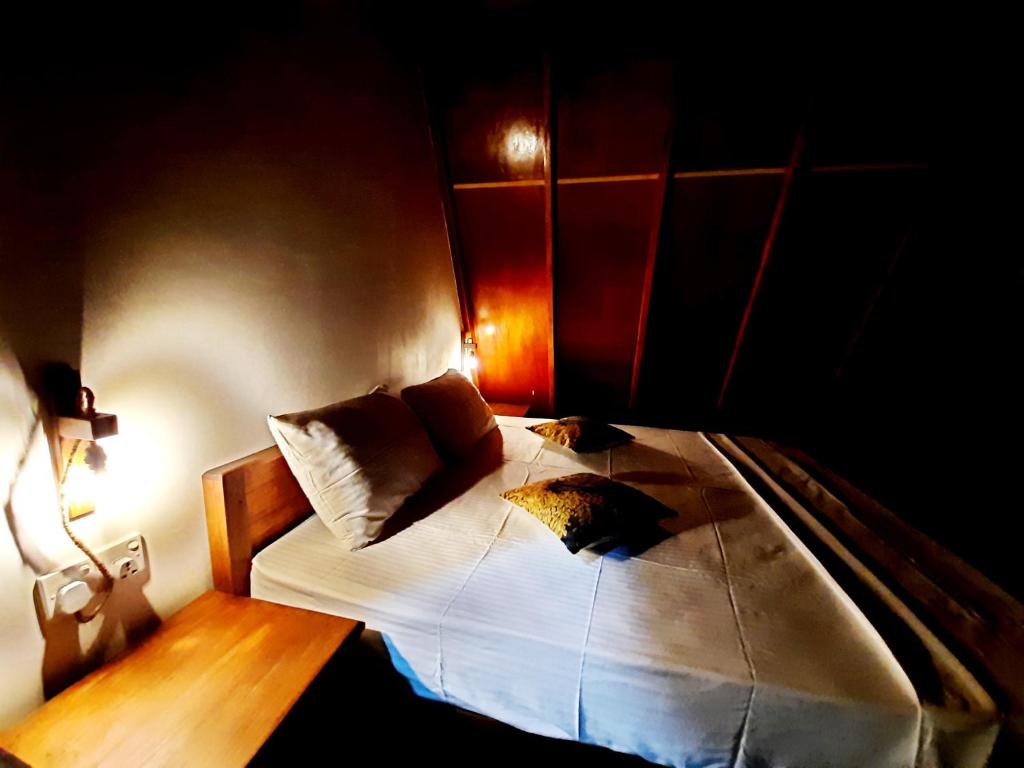 Postel nebo postele na pokoji v ubytování The Otunna Guest House Sigiriya