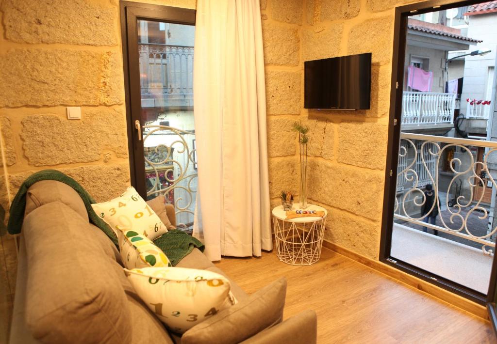 TV a/nebo společenská místnost v ubytování CASA DAS FERREIRAS Cangas