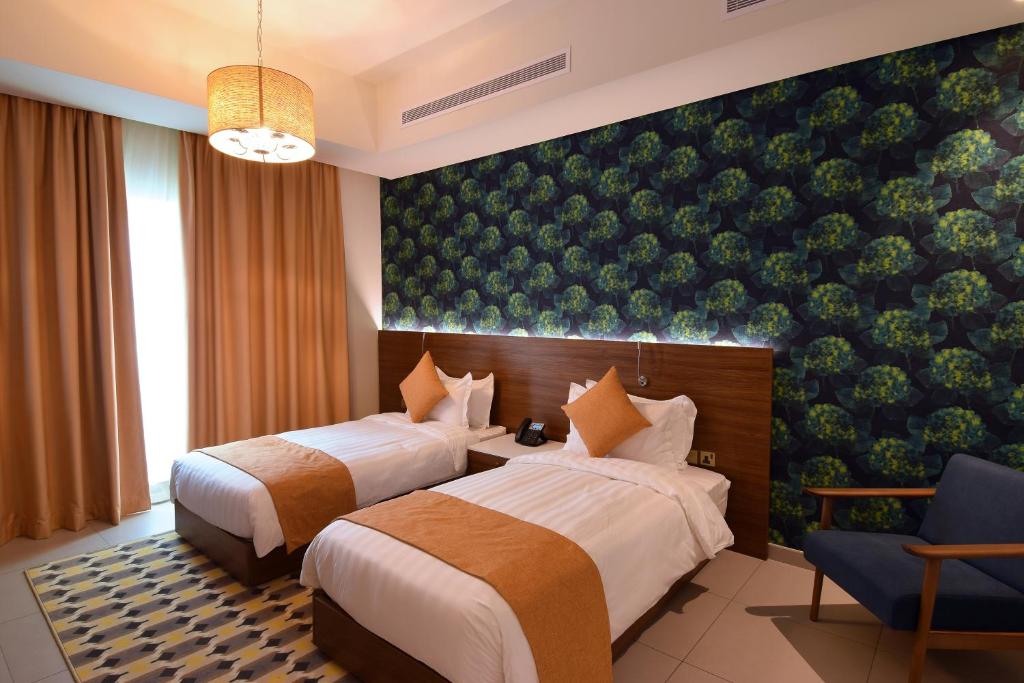 Een bed of bedden in een kamer bij Flamingo Hotel