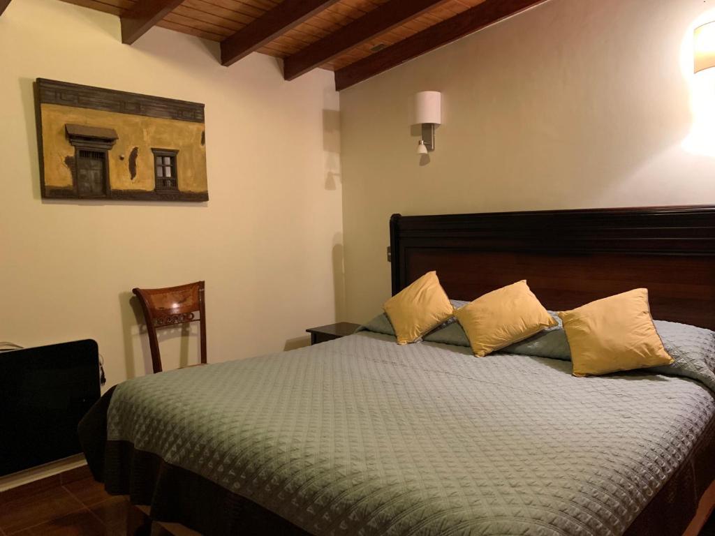 Postel nebo postele na pokoji v ubytování Hostal Puritama