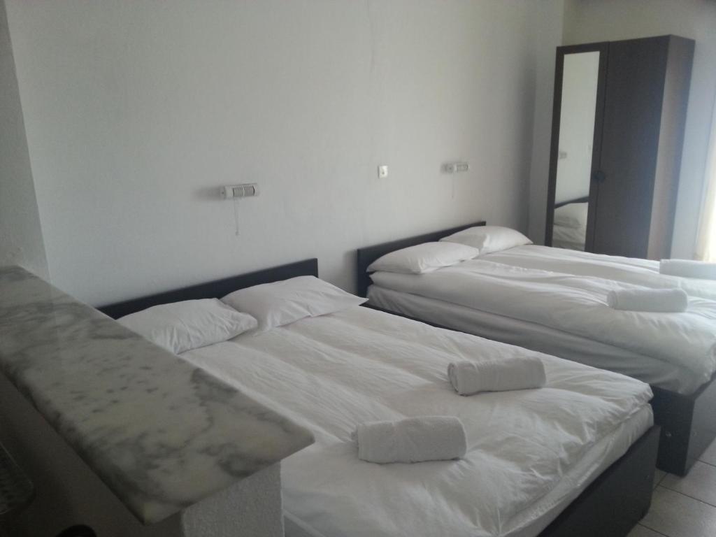 Postel nebo postele na pokoji v ubytování Alexandros Hotel