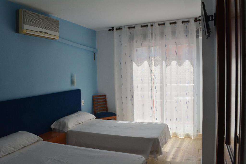 Cama o camas de una habitación en Hotel L'Escala