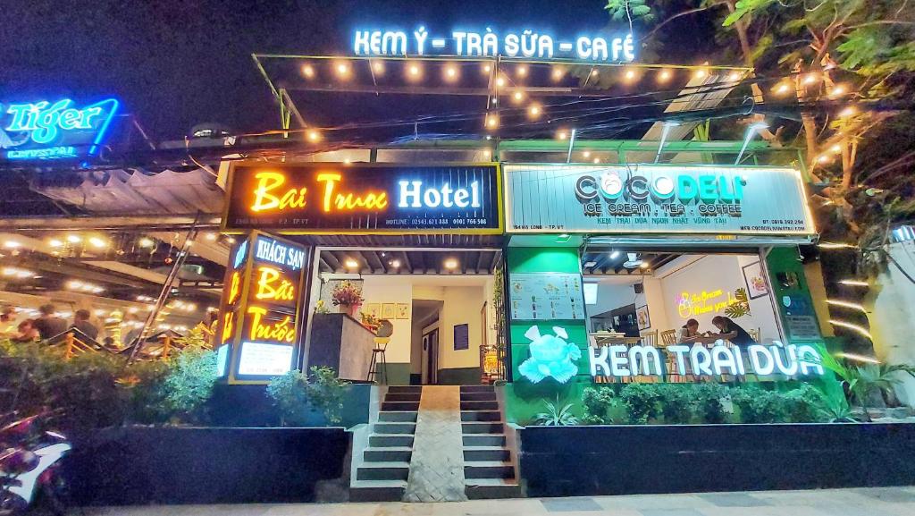 a restaurant with neon signs in front of it at Bai Truoc Hotel in Vung Tau