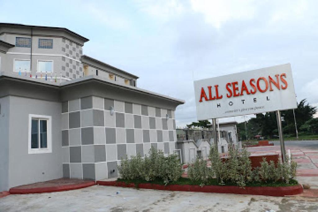 an all seasons hotel sign in front of a building at Room in Lodge - All Seasons Hotel-owerri in Owerri