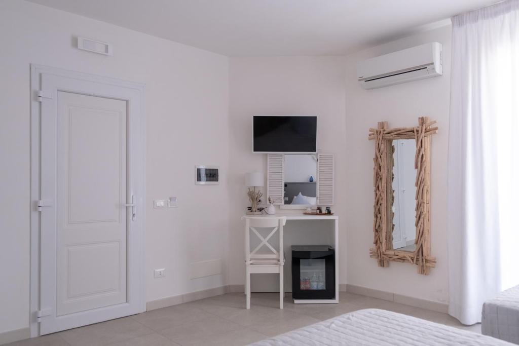 Televízia a/alebo spoločenská miestnosť v ubytovaní B&B Villa Sara