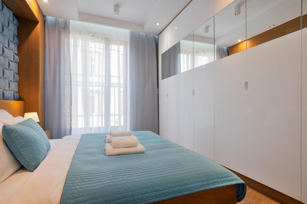 Posteľ alebo postele v izbe v ubytovaní Apartamenty Prestige Browar Lubicz Stare Miasto