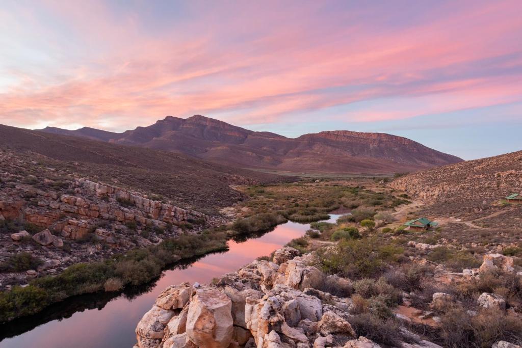 a river in the desert with mountains in the background at Mount Ceder in Cederberg