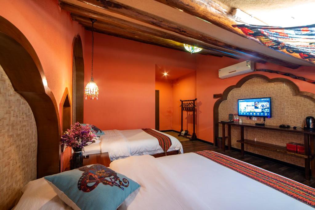 Letto o letti in una camera di Zhangjiajie Highlights Guesthouse
