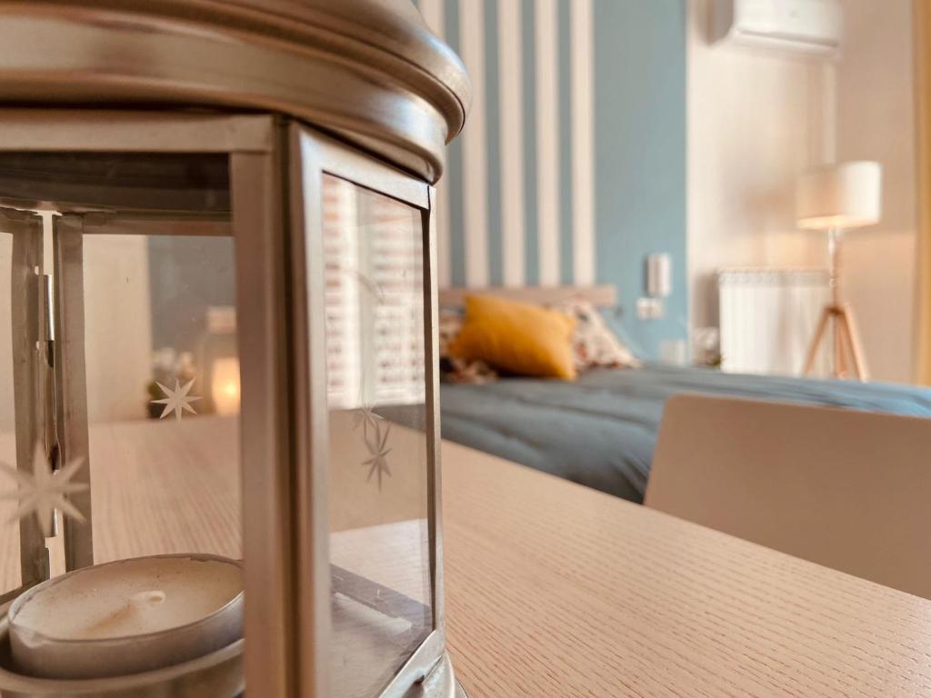 a room with a table with a bed in the background at Casa Antonietta in San Paolo Bel Sito