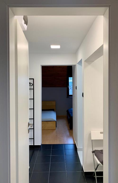Postel nebo postele na pokoji v ubytování Vár-Lak Apartman