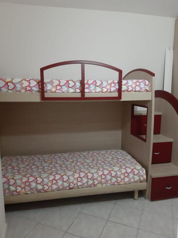 Łóżko lub łóżka w pokoju w obiekcie Casa Mare Ludovica