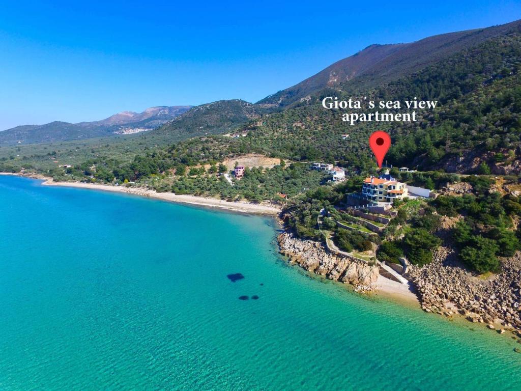 an aerial view of a beach with a red marker at Giotas Sea View Apartment in Skala Kallirakhis