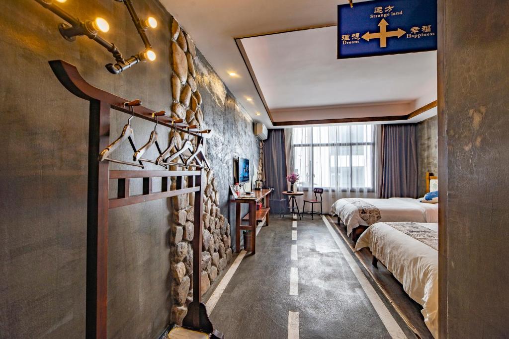 Letto o letti in una camera di Zhangjiajie Highlights Guesthouse