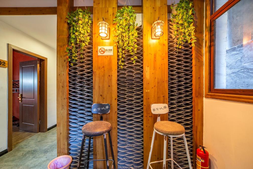 Area soggiorno di Zhangjiajie Highlights Guesthouse