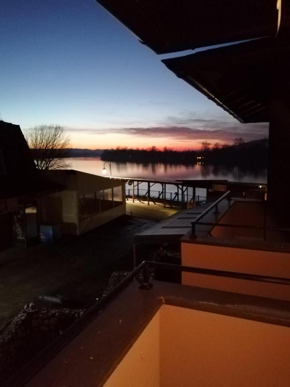 a view of a marina at sunset from a building at Biser in Veliko Gradište