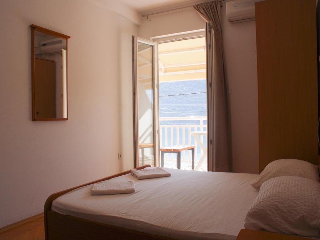 Postel nebo postele na pokoji v ubytování Apartments and Rooms Mato