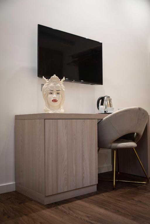 TV a/nebo společenská místnost v ubytování Fervore Luxury Rooms