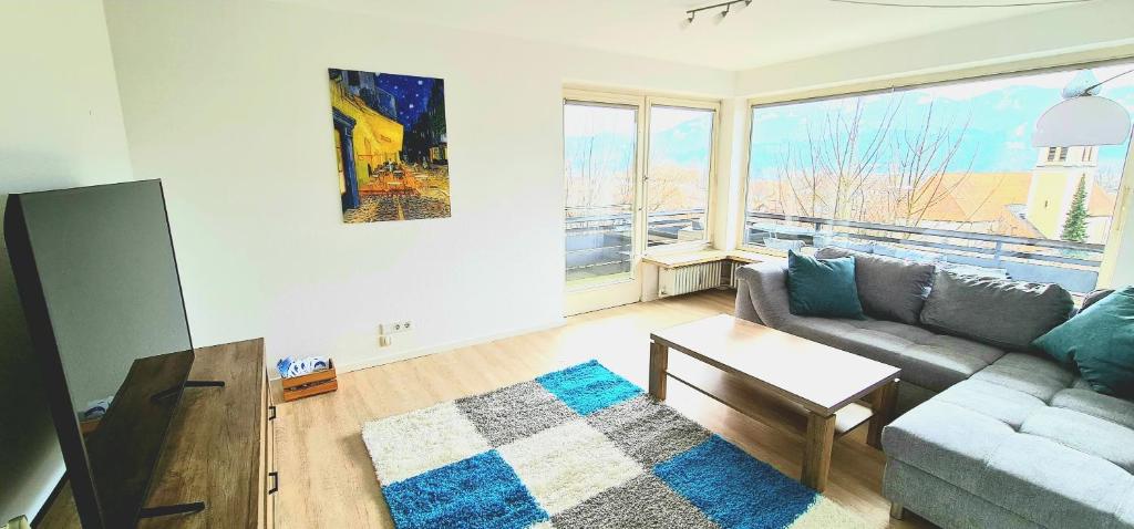 a living room with a couch and a table at Sanosueno 3 in Sonthofen