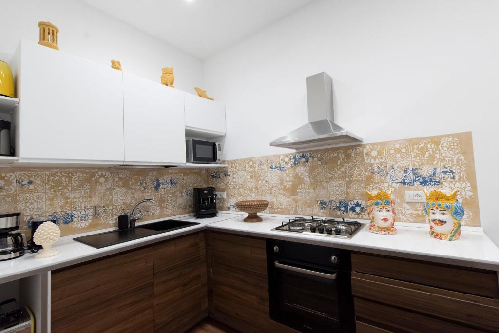 Kuchyň nebo kuchyňský kout v ubytování Fervore Luxury Rooms