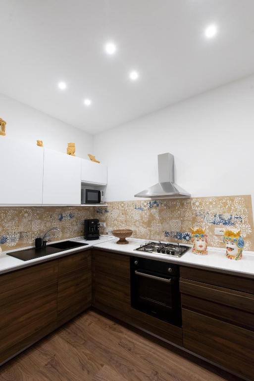 Kuchyň nebo kuchyňský kout v ubytování Fervore Luxury Rooms