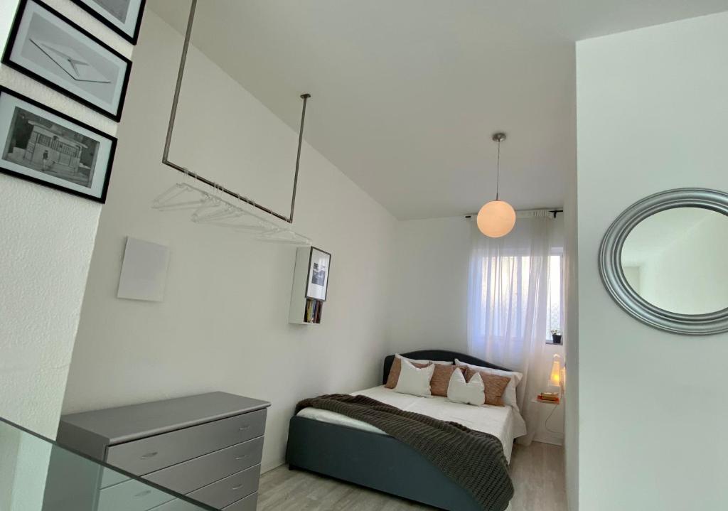 Postel nebo postele na pokoji v ubytování Scalabrini LOFT
