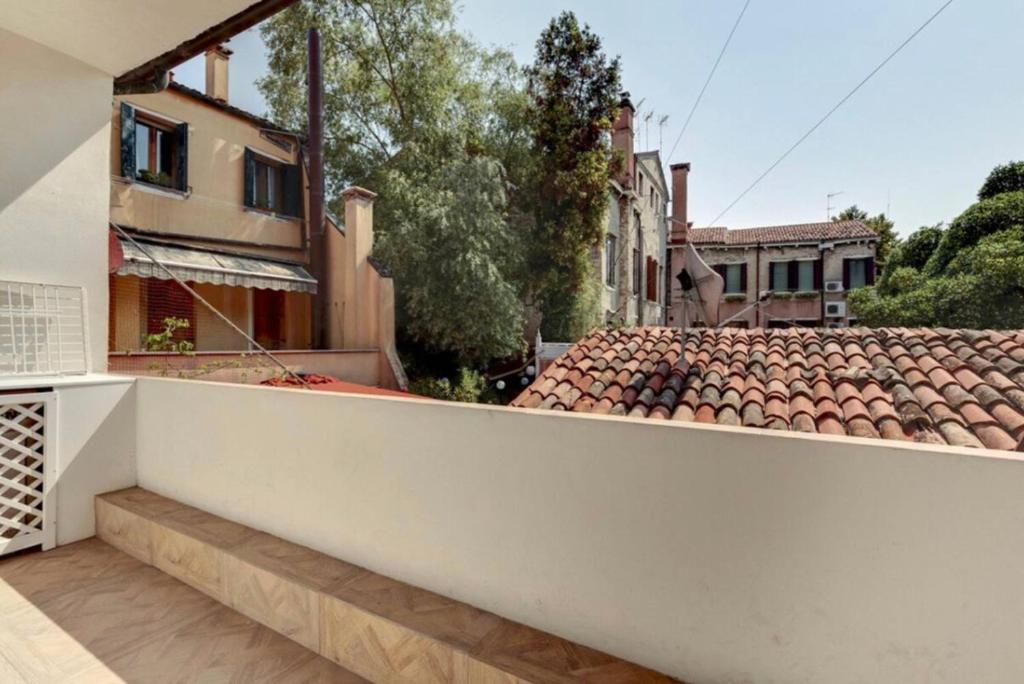 a view from the balcony of a house with a roof at Venice traditional home with terrace in Venice