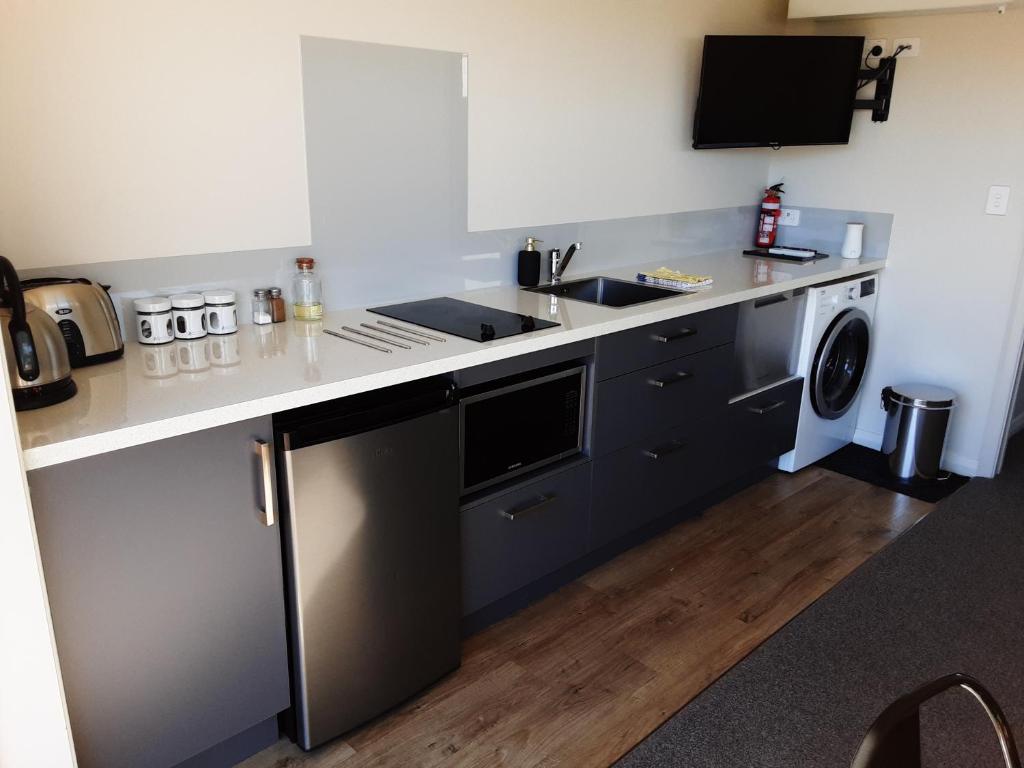 a kitchen with a sink and a dishwasher at Two Thumbs Unit 2 in Lake Tekapo