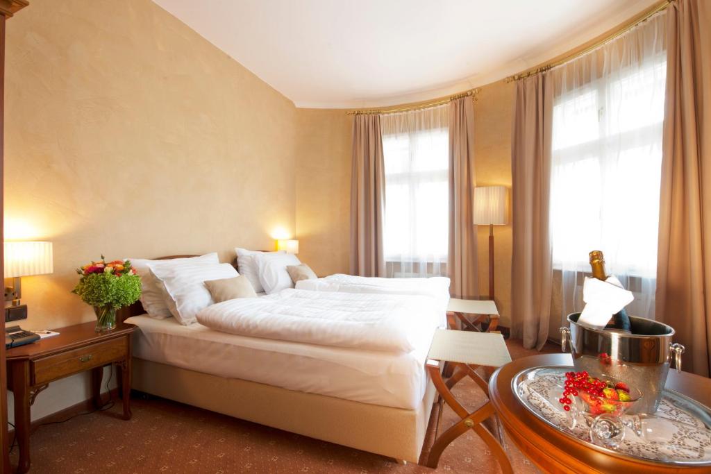 Postel nebo postele na pokoji v ubytování Hotel Sacher Baden