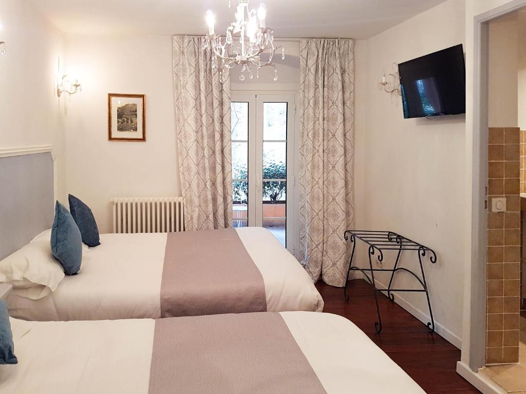 Postel nebo postele na pokoji v ubytování Hôtel Restaurant U Castellu Vizzavona