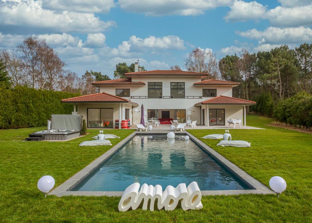 a house with a swimming pool in the yard at HOUSE ZYX in Le Touquet-Paris-Plage