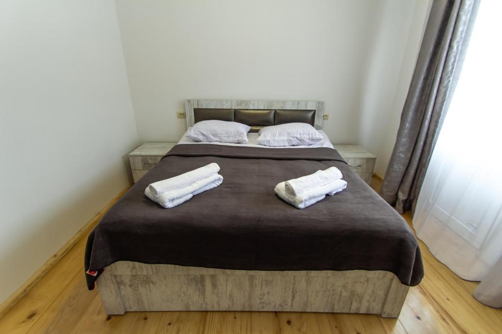 Postel nebo postele na pokoji v ubytování Katos Guesthouse Mestia