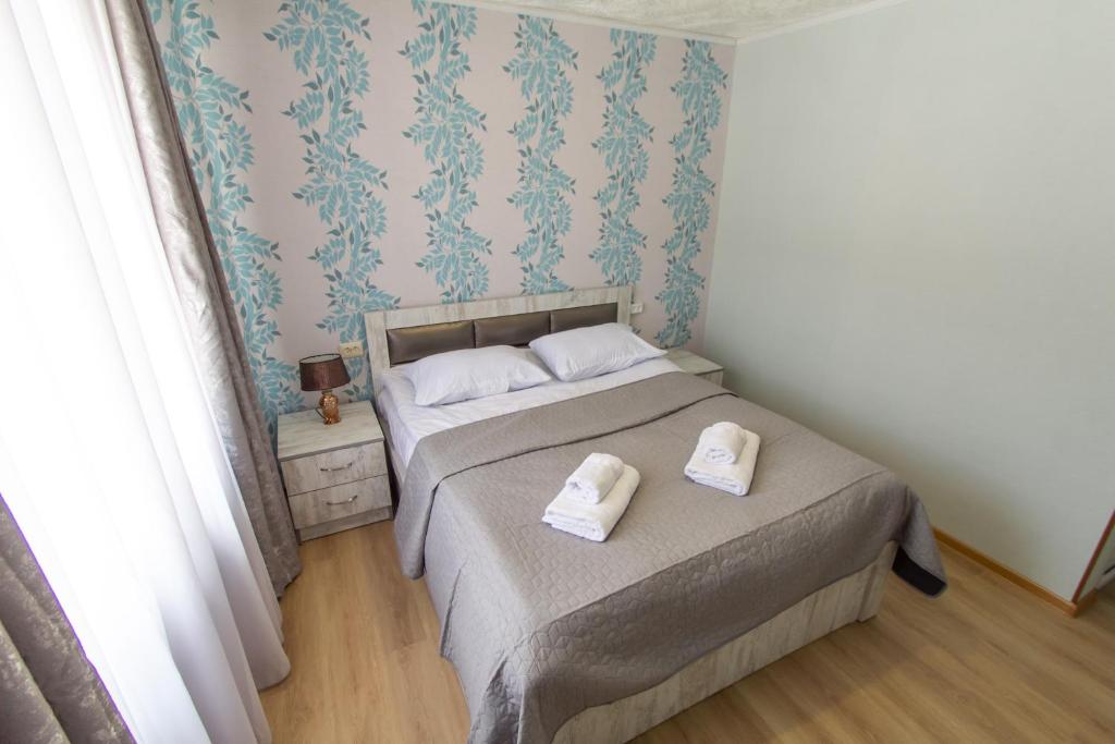 Postel nebo postele na pokoji v ubytování Katos Guesthouse Mestia